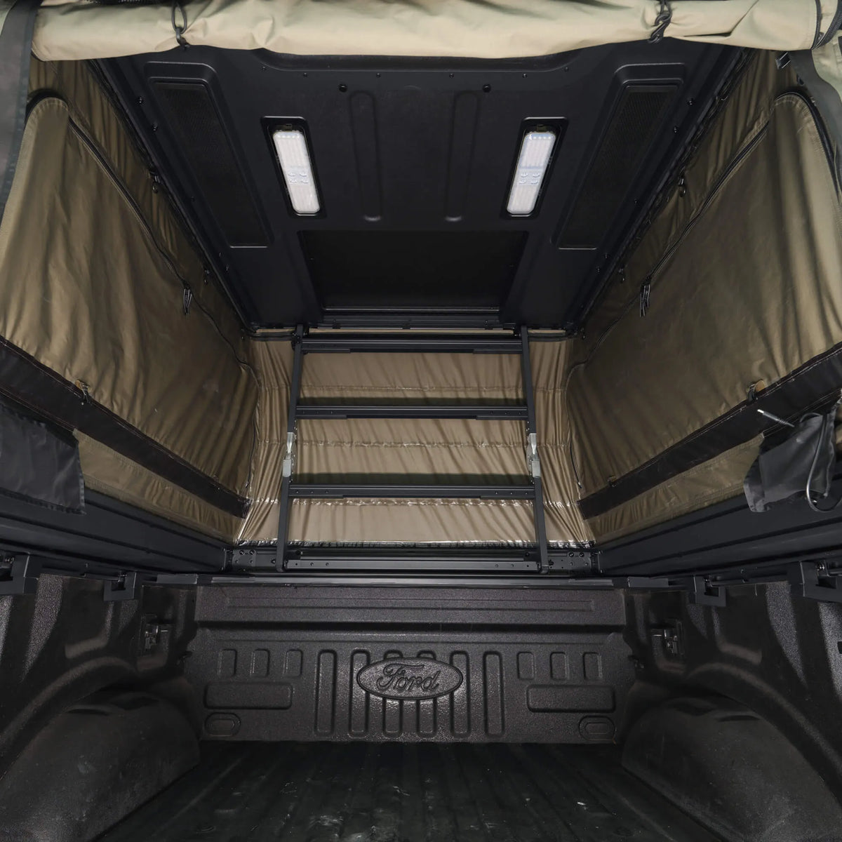 Interior of WinTopper showing the raised roof, lighting and flexible truck bed space